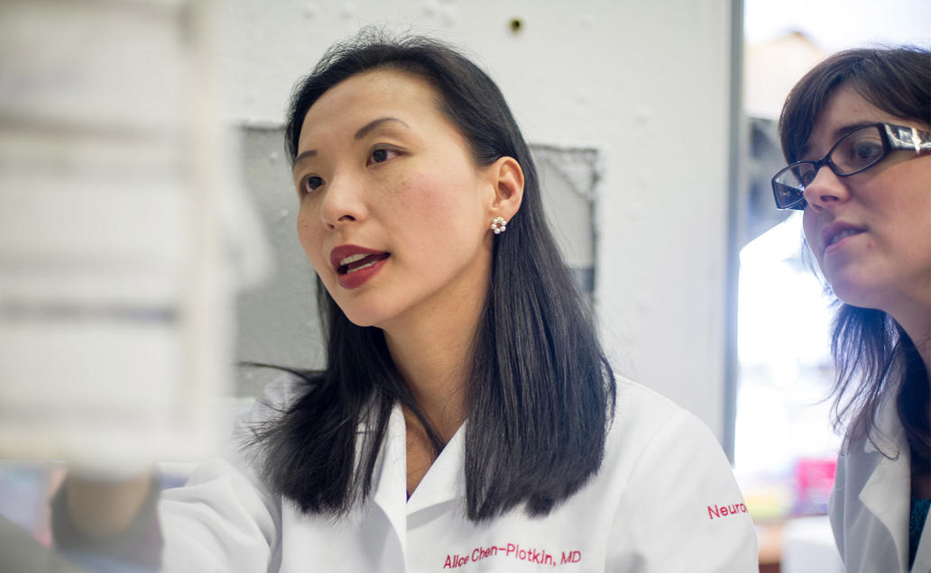 Two female doctors talking in the lab.