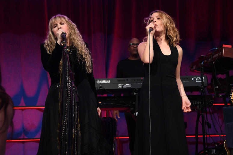 Stevie Nicks and Maggie Rogers perform onstage. 