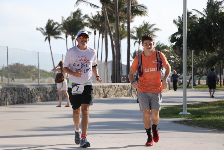 bret running with a supporter