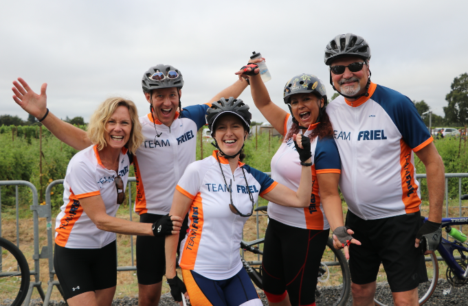 Team Friel riders pose in front of bikes