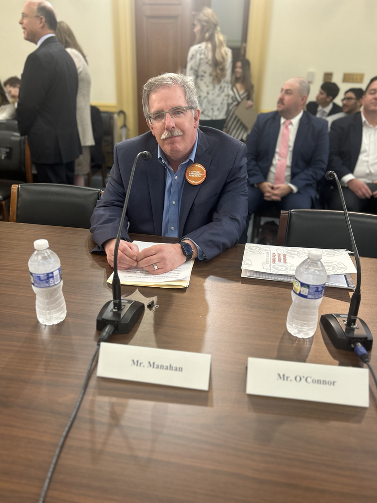 George Manhan at the hearing table for National Plan