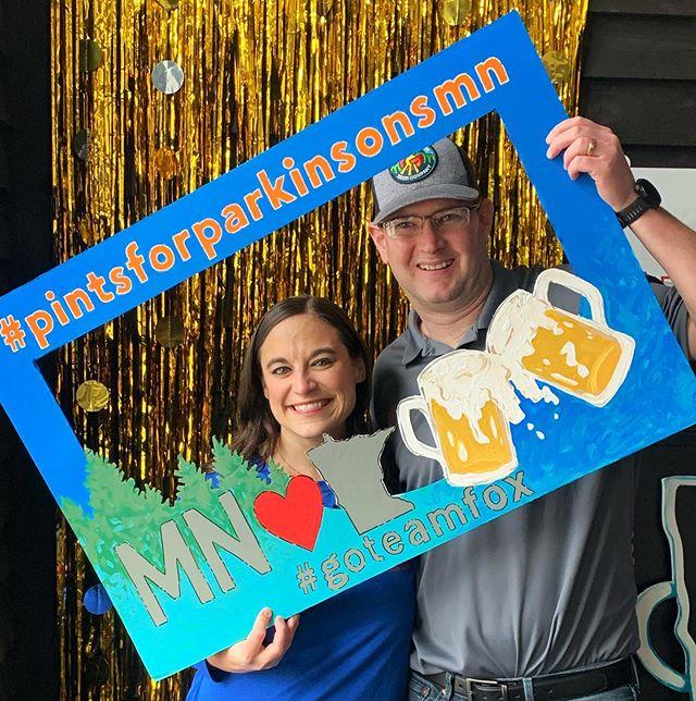 Two Team Fox fundraisers holding a "selfie" frame at a Pints for Parkinson's event