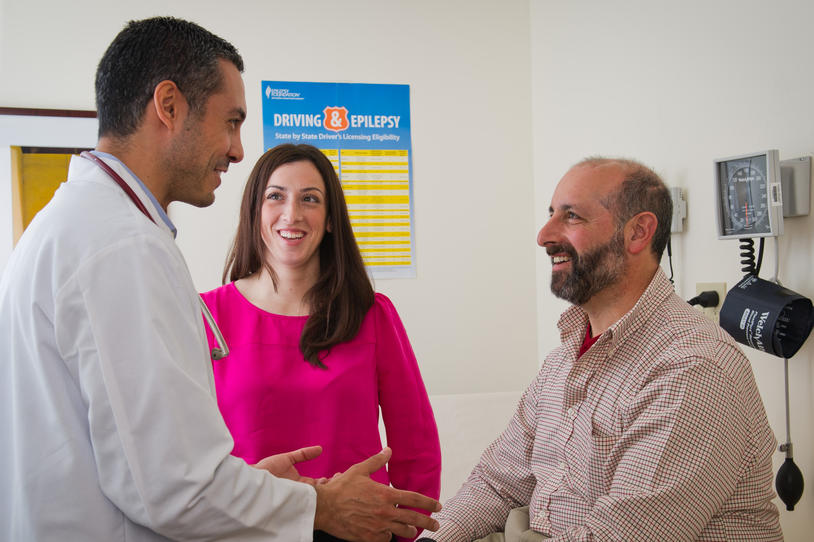 Doctor and two people in clinic room