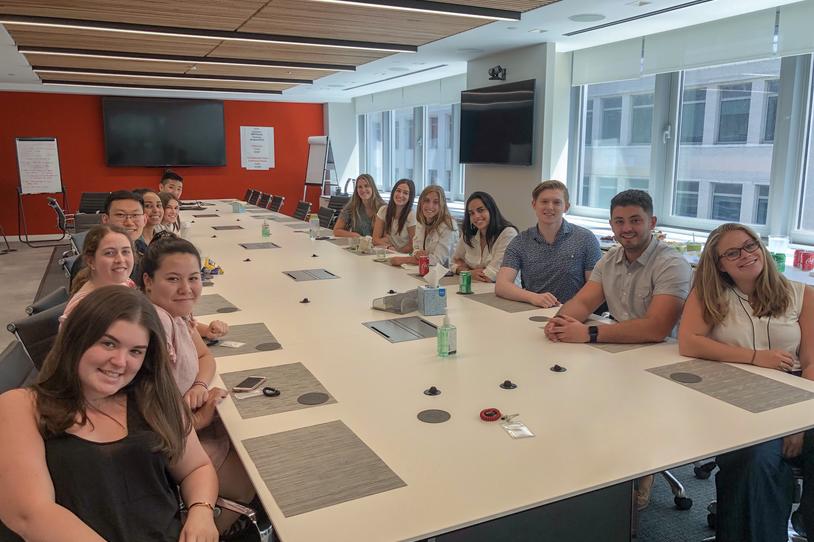 MJFF's summer Interns sitting around the table in a conference room.