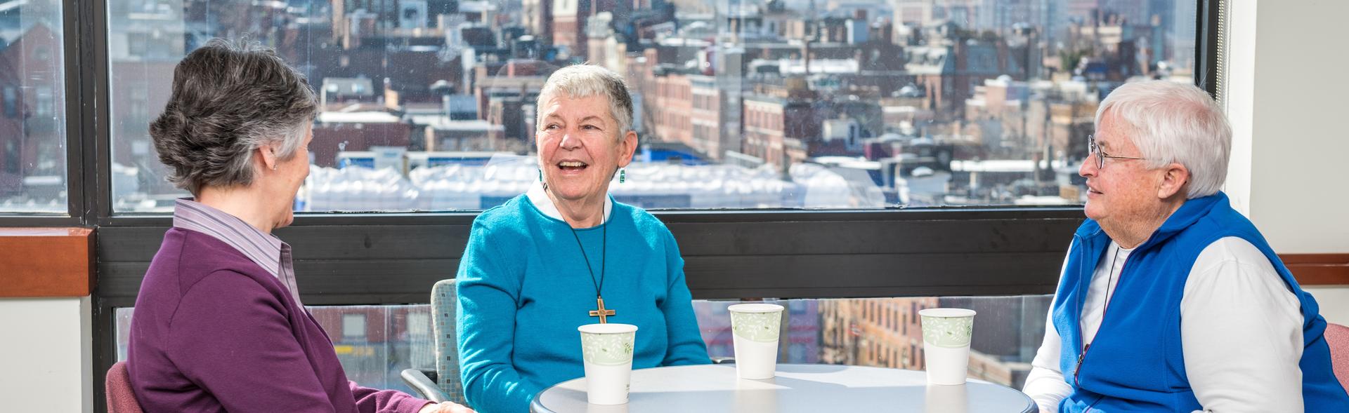 People sitting at a table and smiling