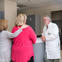 Three people talking at a clinic